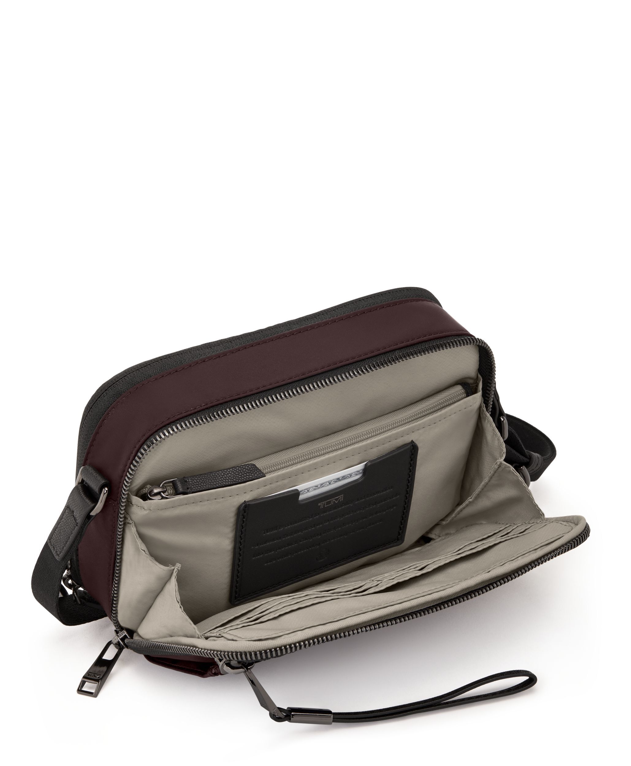 Tumi voyageur top sling bag
